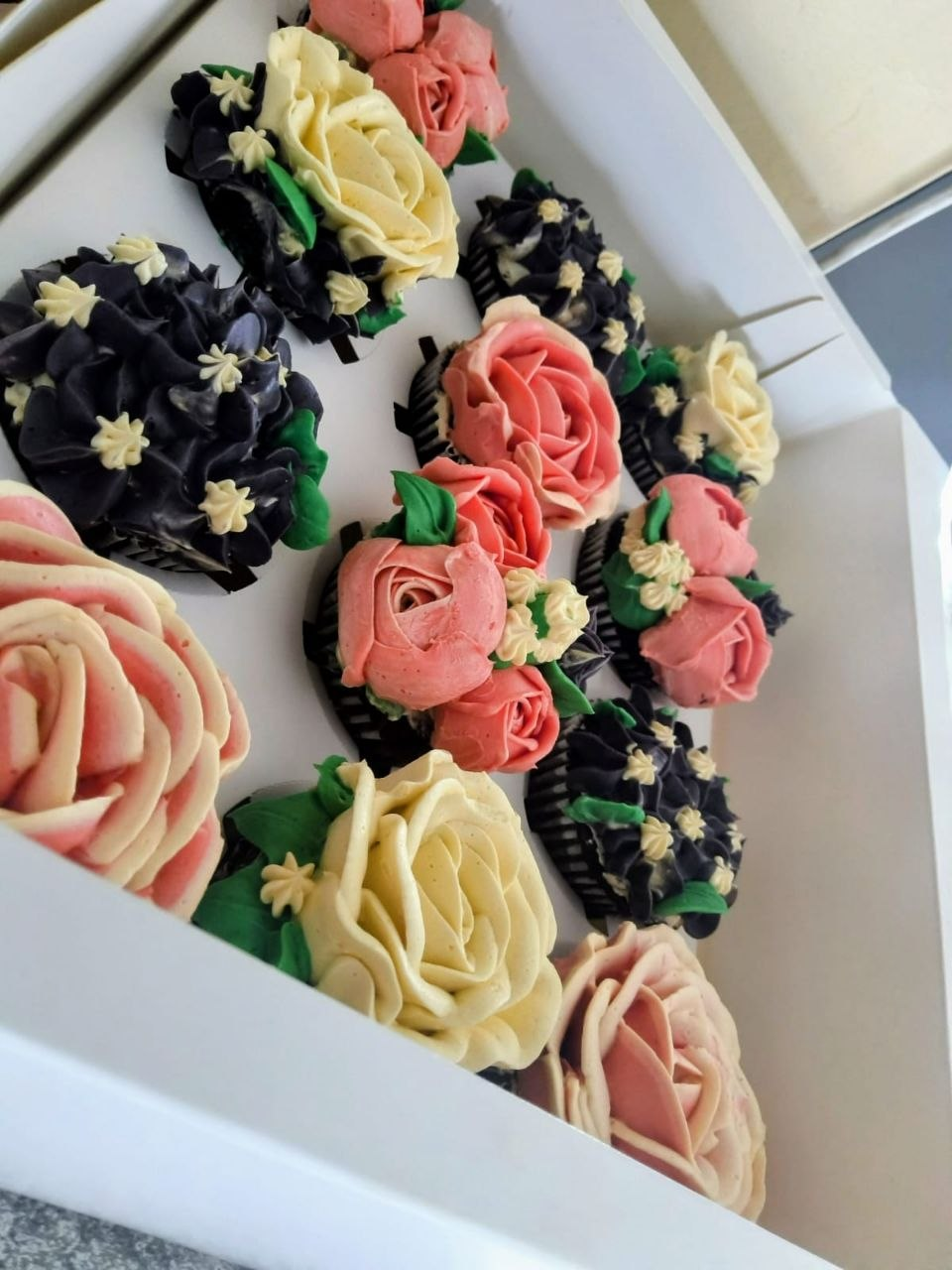 Black and ivory floral cupcake arrangement